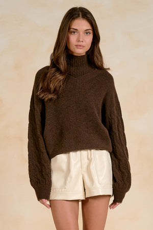 Peekaboo turtleneck sweater with braided Sleeves