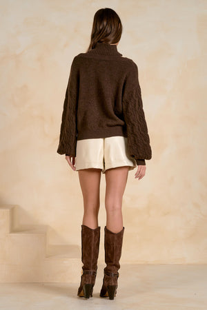 Peekaboo turtleneck sweater with braided Sleeves