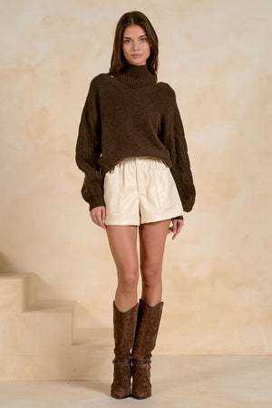 Peekaboo turtleneck sweater with braided Sleeves