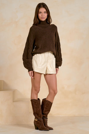 Peekaboo turtleneck sweater with braided Sleeves